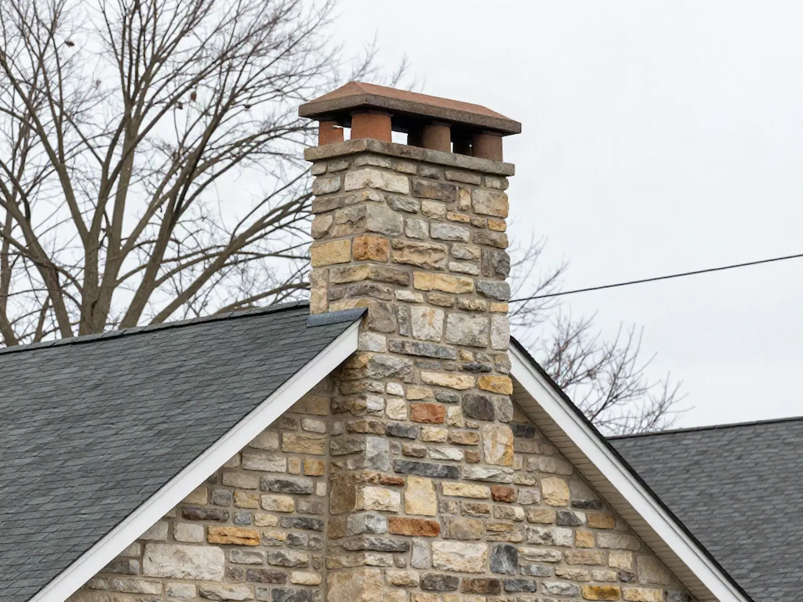 Brick chimney on a home served by Christie & Son Chimney Service in Middlefield, CT